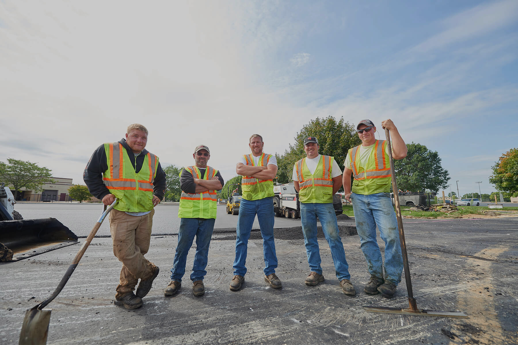 Workers standing in a line outside